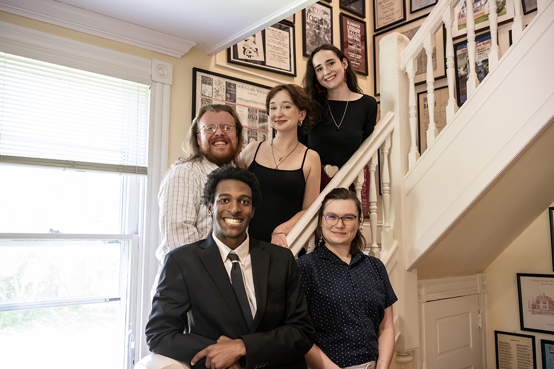 The 2024 finalists for the Sophie Kerr Prize pose on the stairs in the Washington College Rose O'Neill Literary House