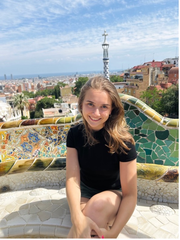 student in front of a mosaic in Barcelona