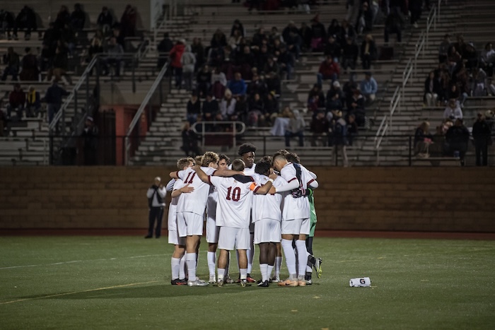 Men's soccer team in front of fans