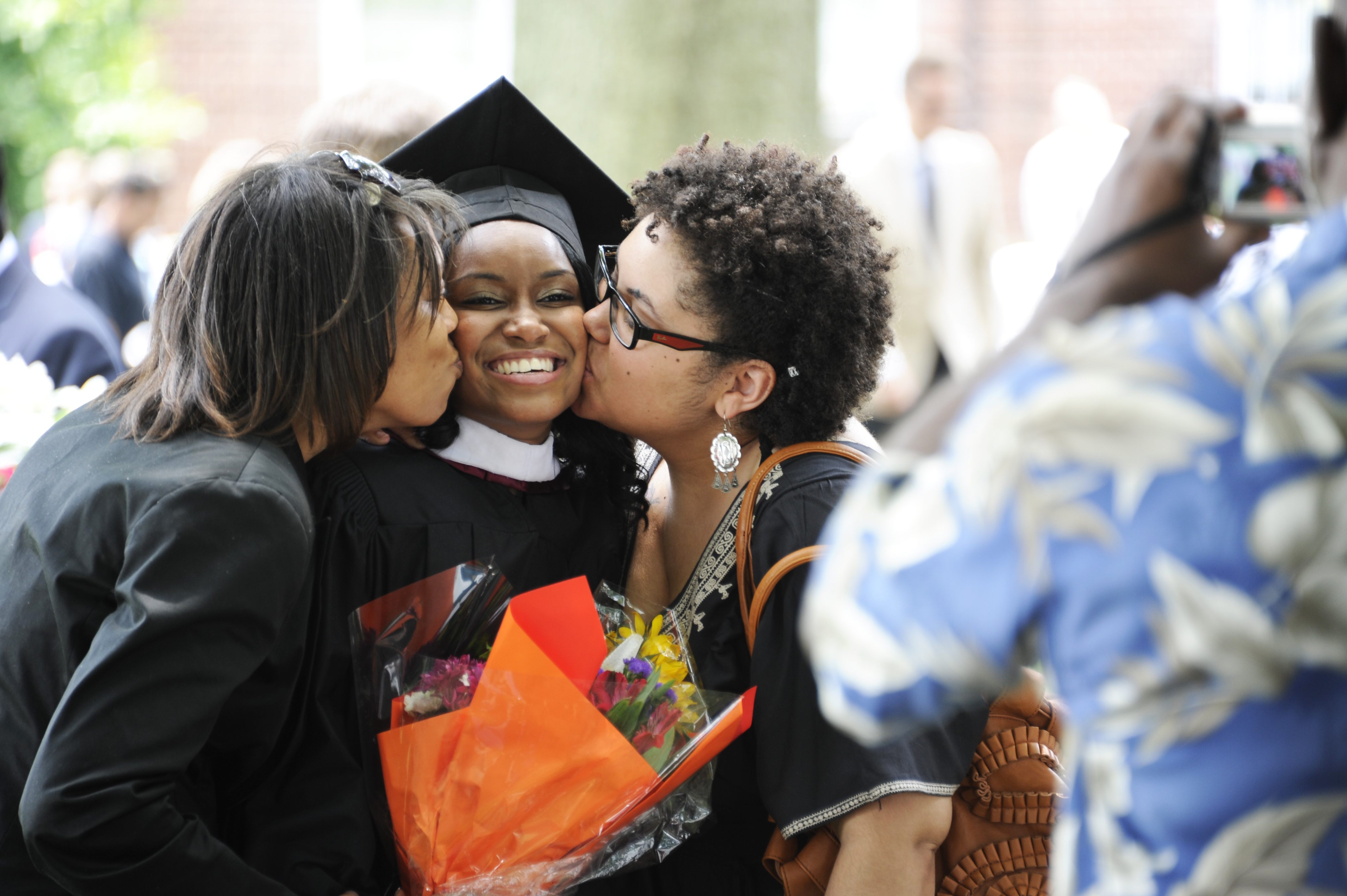 WC graduate being embraced by family in celebration  