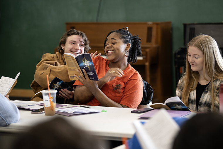 students laugh during a table read