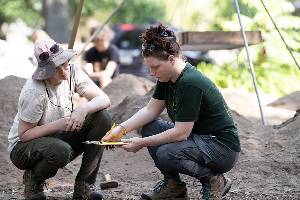 students participate in archaeology dig