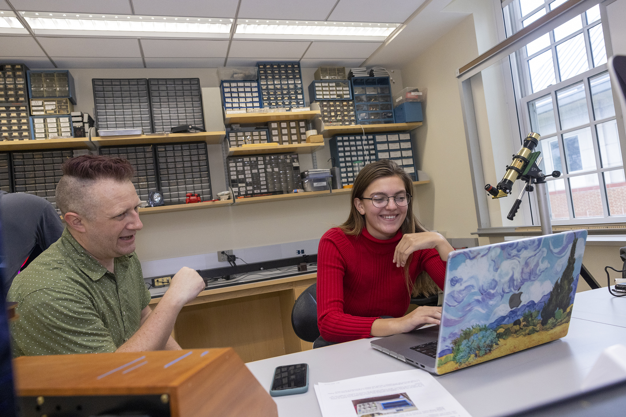 student working with professor