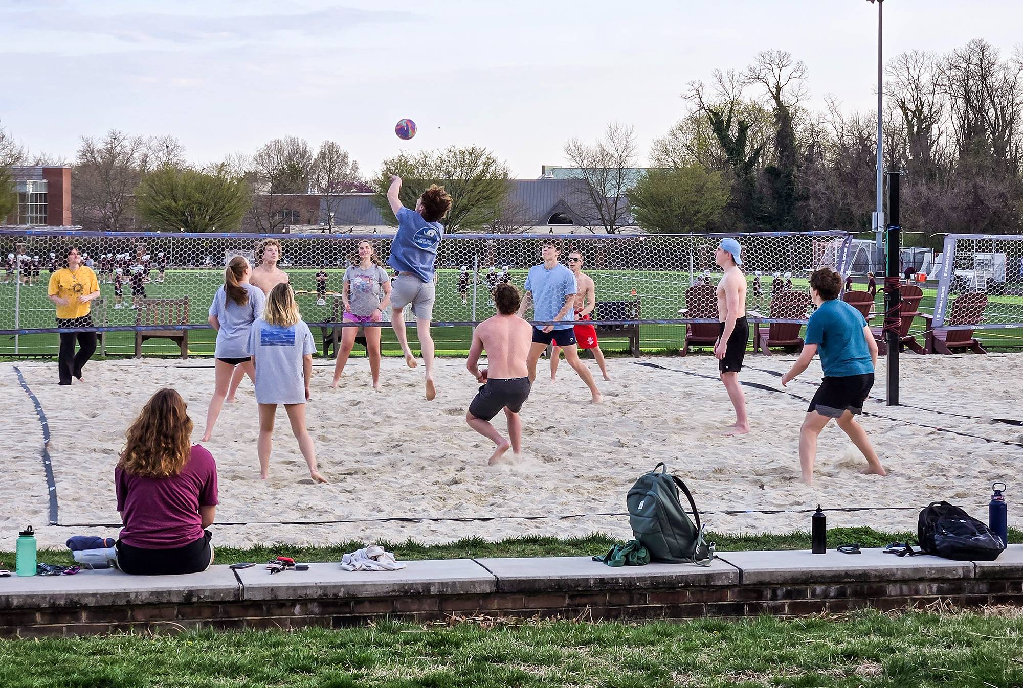 students playing beach volleyball
