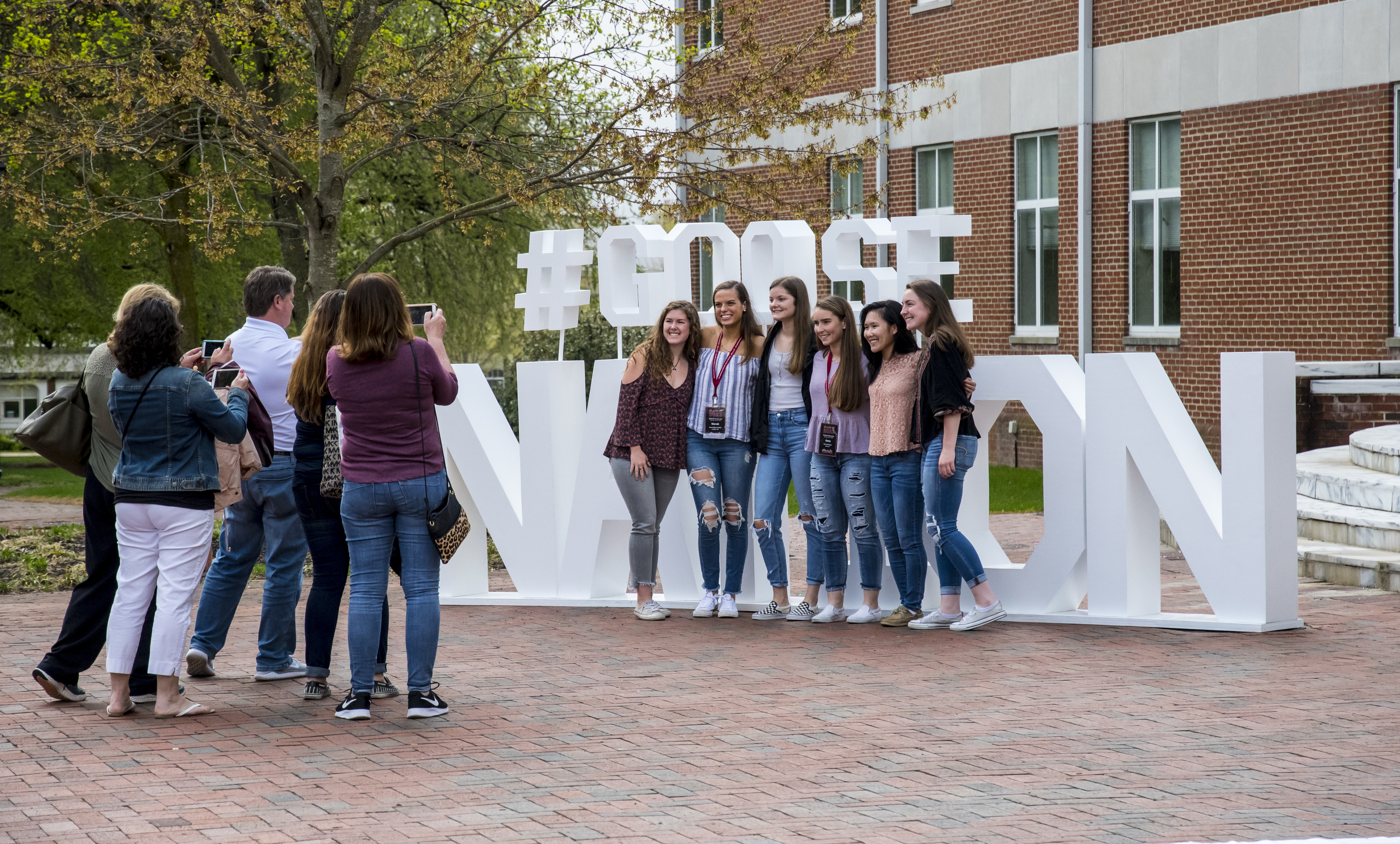 Students in front of Goose Nation Sign