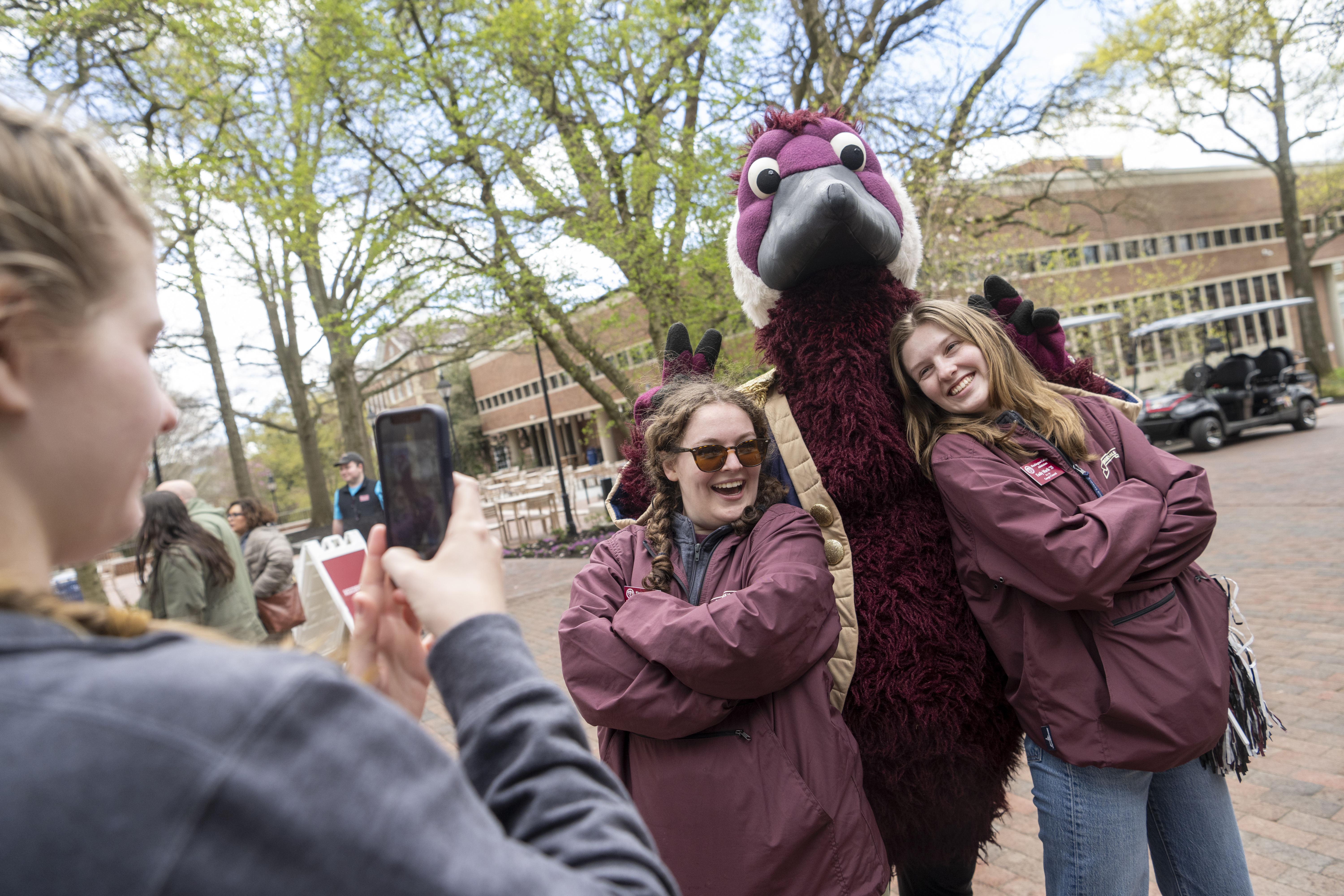 Students posing with Gus the Goose