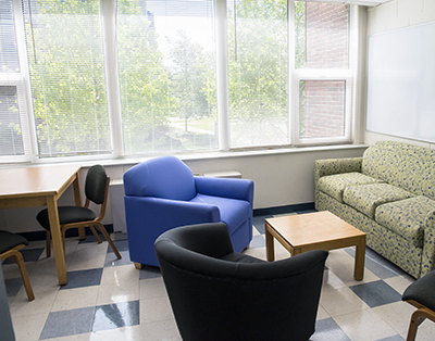 Kent lounge with window, table, chairs and couch