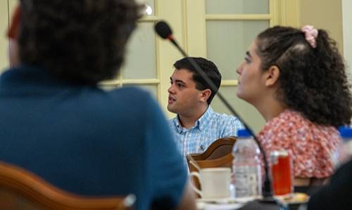 a student listens at a presentation on free speech