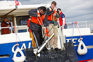 Students working on a boat