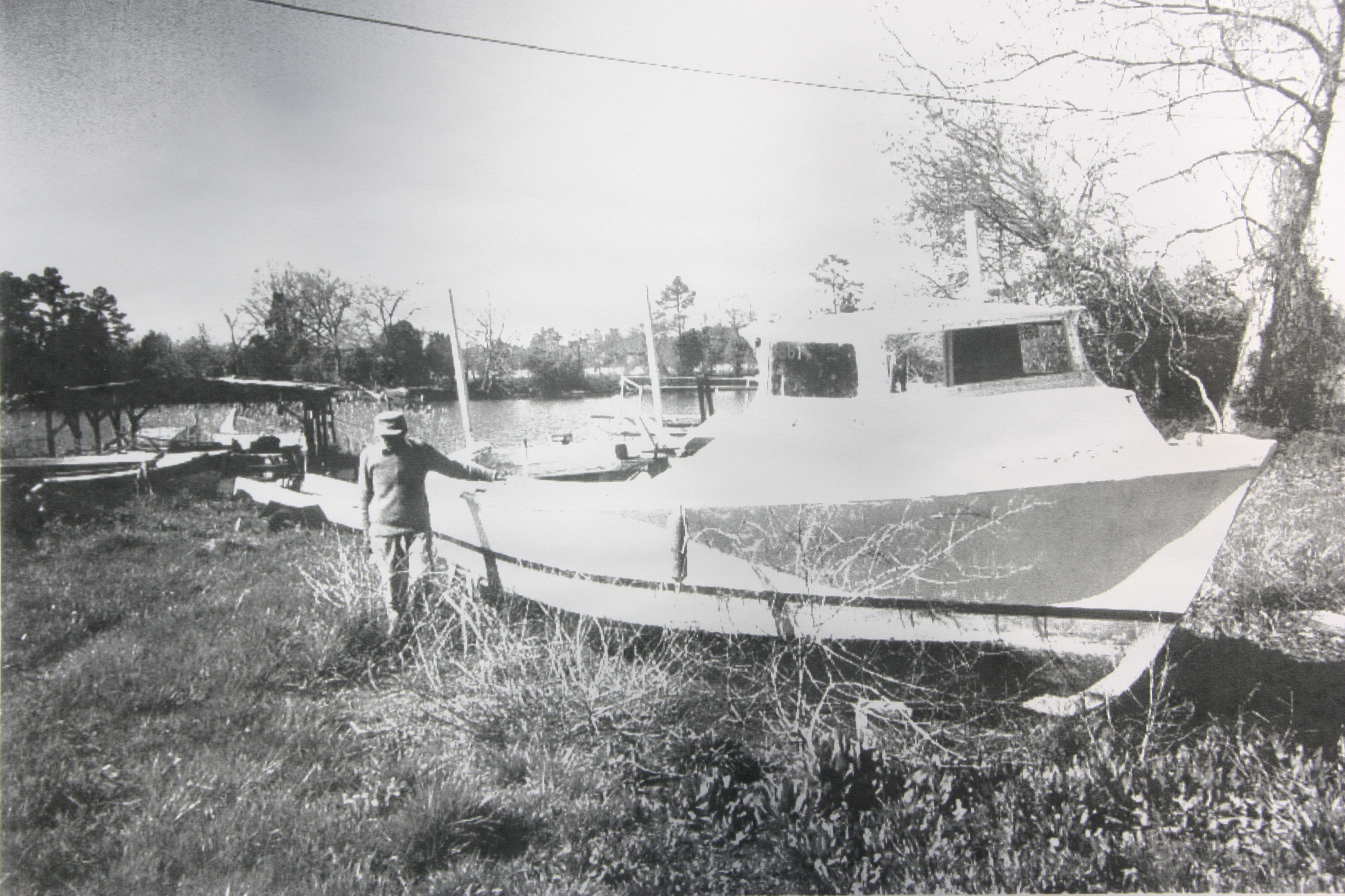 Samuel Eddie Turner and one of the boats he built. 