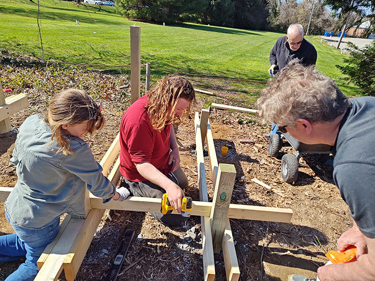 Students working on building deck