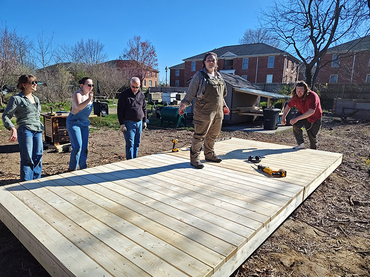 Students looking at finished deck