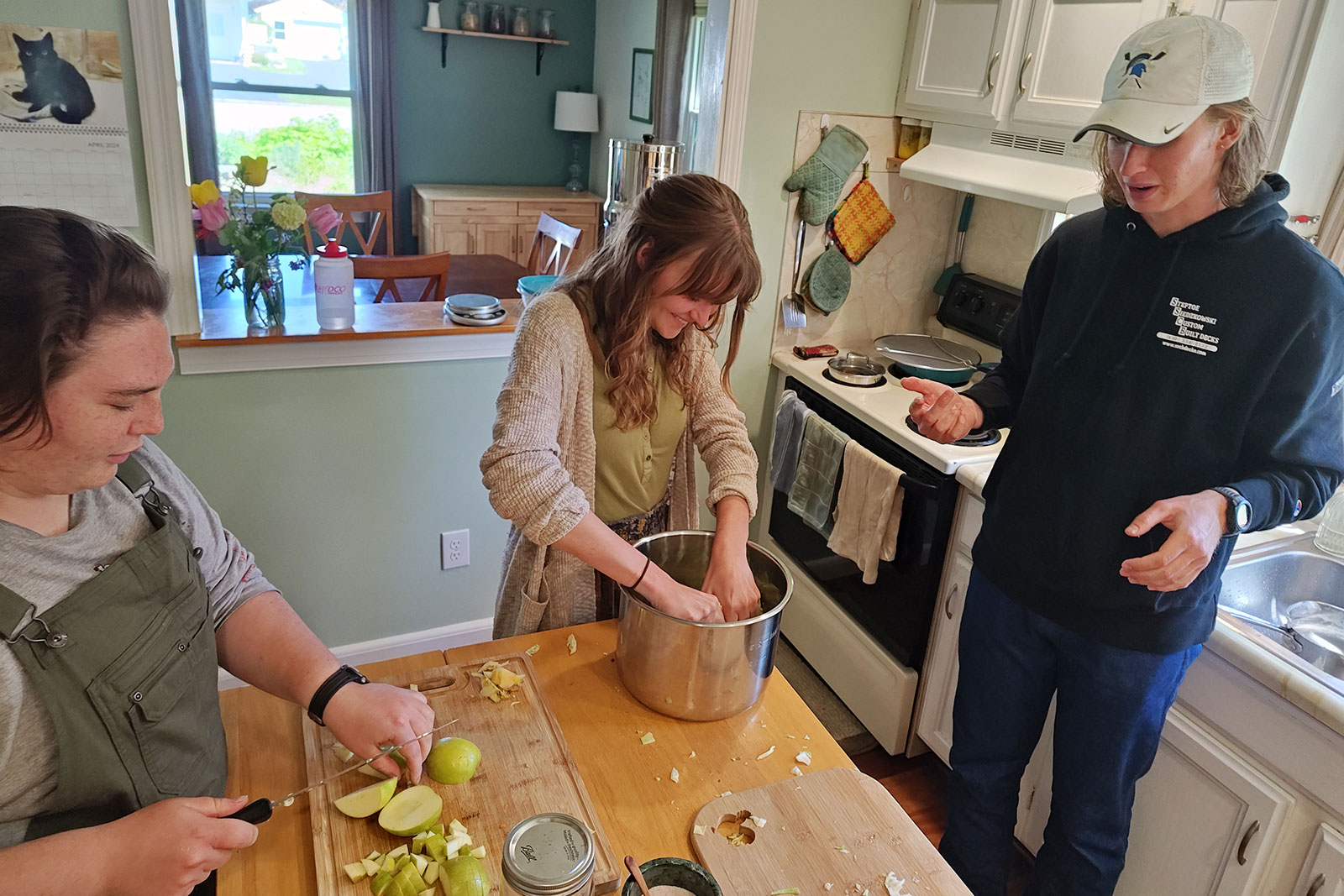 Permaculture Interns preparing food for the May Day Celebration