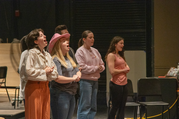 The cast of 9 to 5 rehearse at Washington College. 