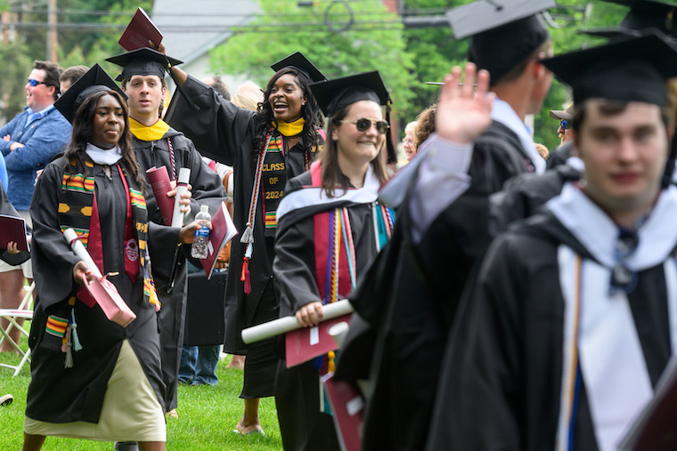 Washington College graduates of the class of 2024 take the college green. 