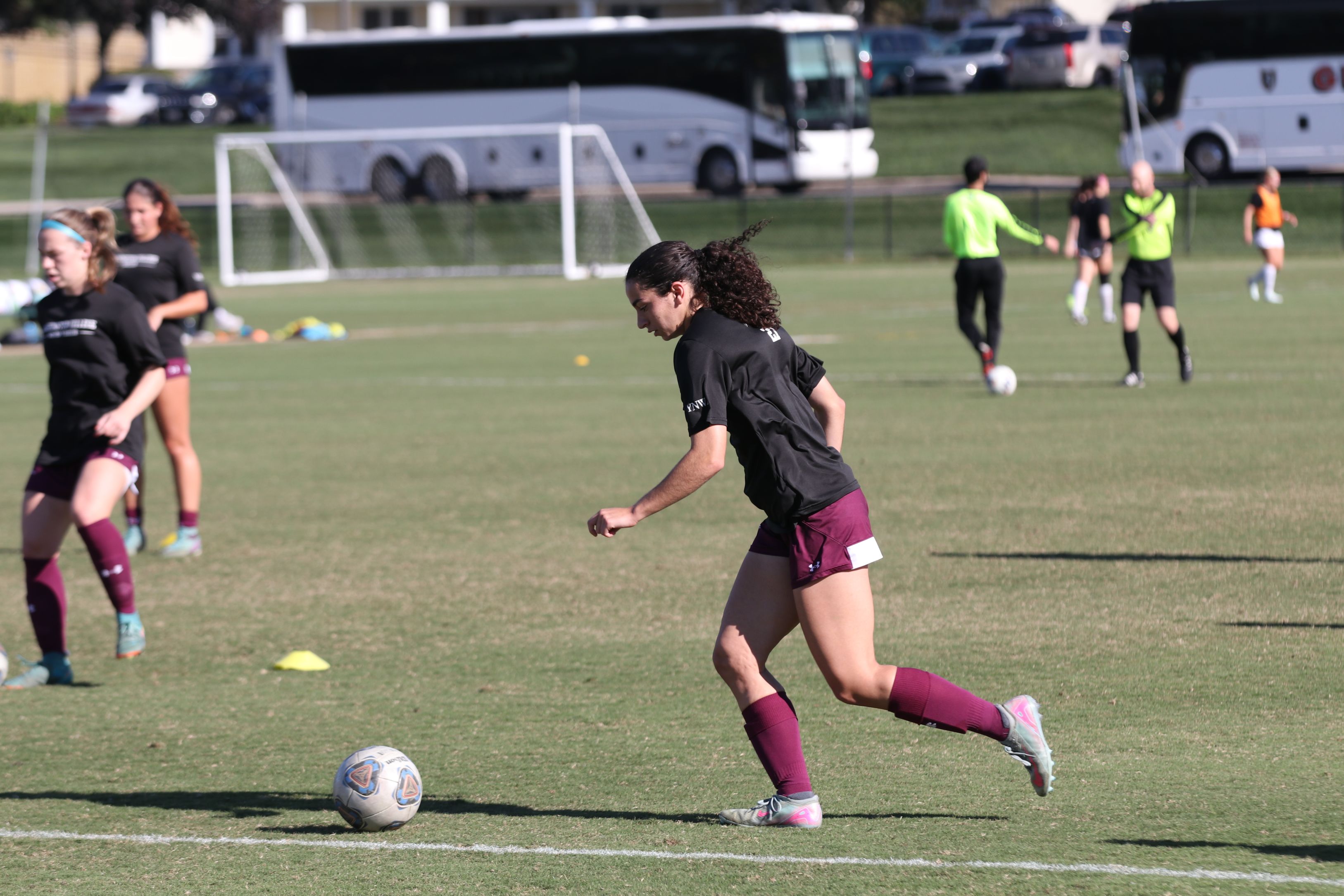 Annie Kotis '29 kicks the soccer ball