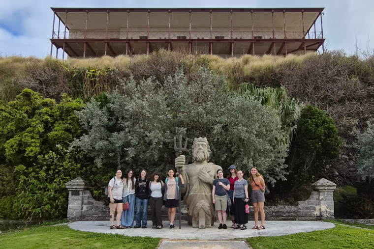 Washington College students in front of a merman statue while on a trip to Bermuda over spring break 2026. Washington College students in front of a merman statue while on a trip to Bermuda over spring break 2026.