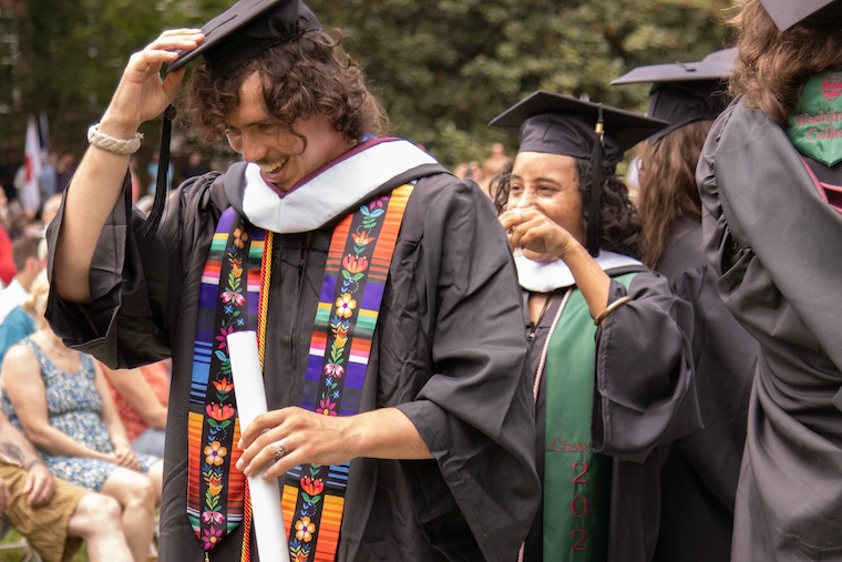 Graduates hood each other at the 2026 Commencement Ceremony 