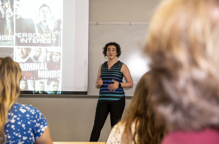 Professor Rachel Durso teaches at the front of a classroom