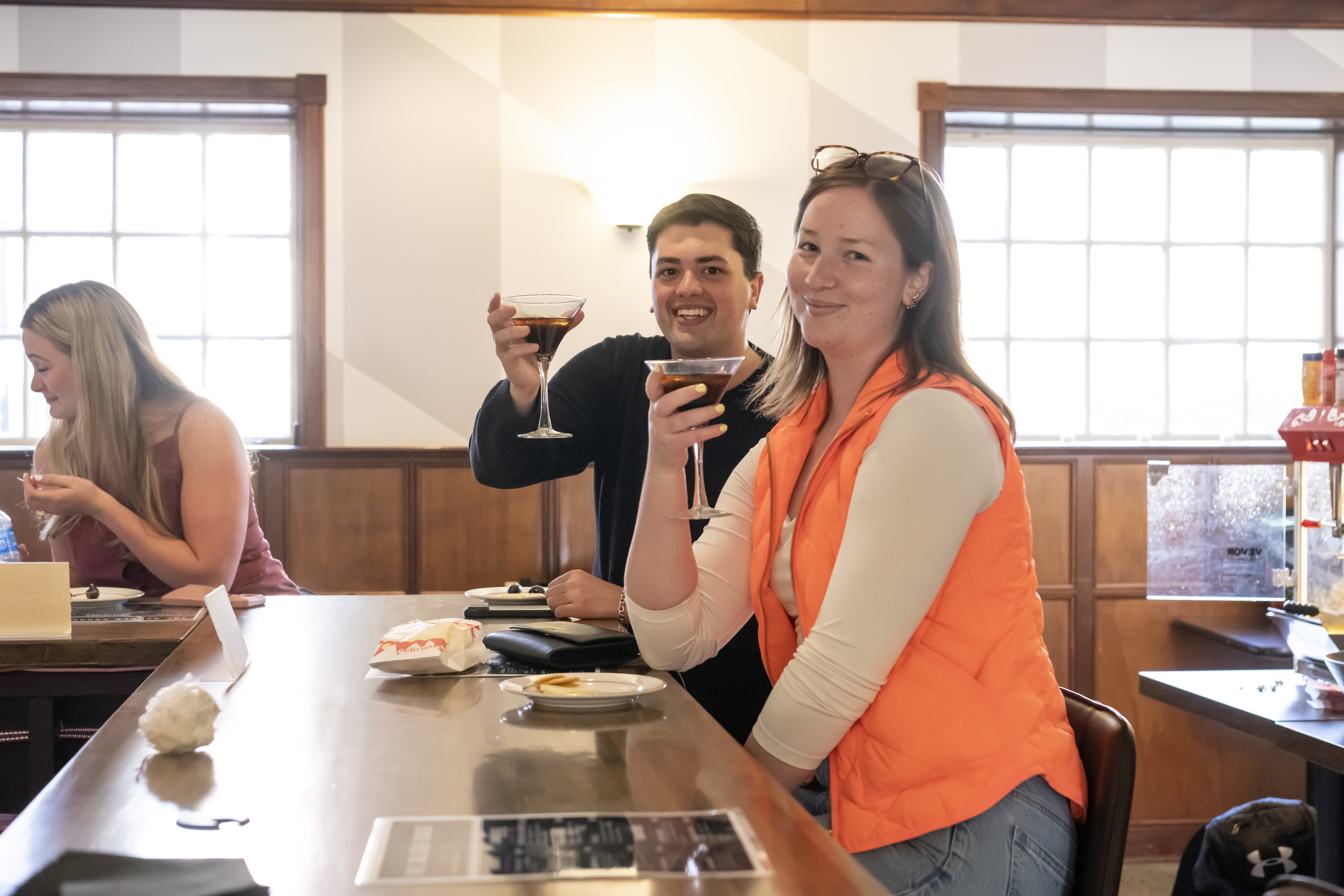 Students cheers at the bar at the new Golden Goose Pub .