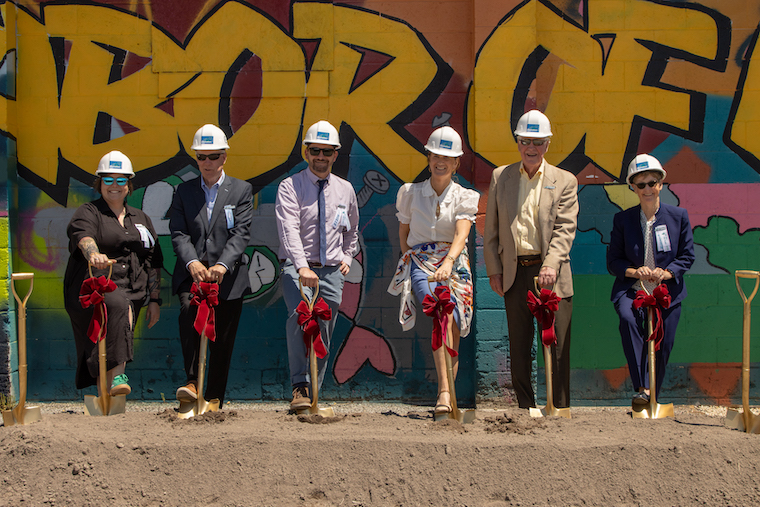 officials with shovels