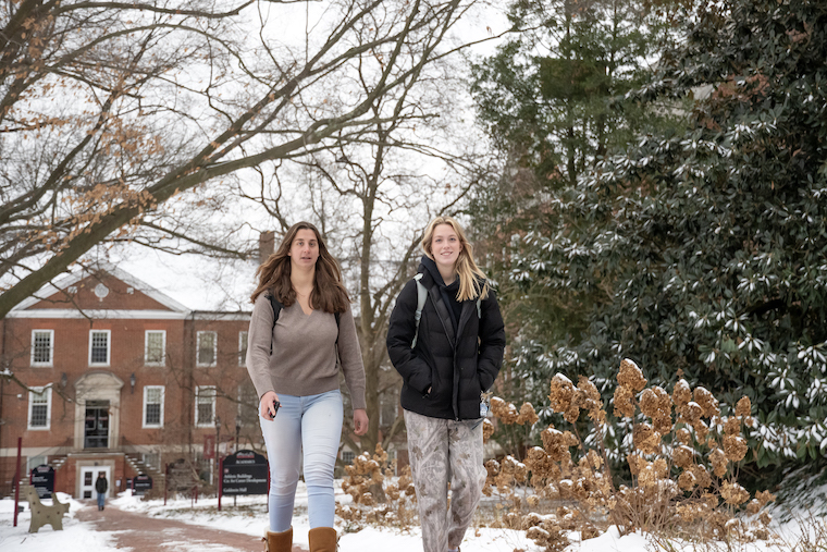 Students on Washington College's campus in winter. 