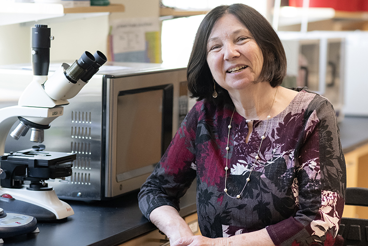 Professor Kate Verville sits for a portrait in her lab