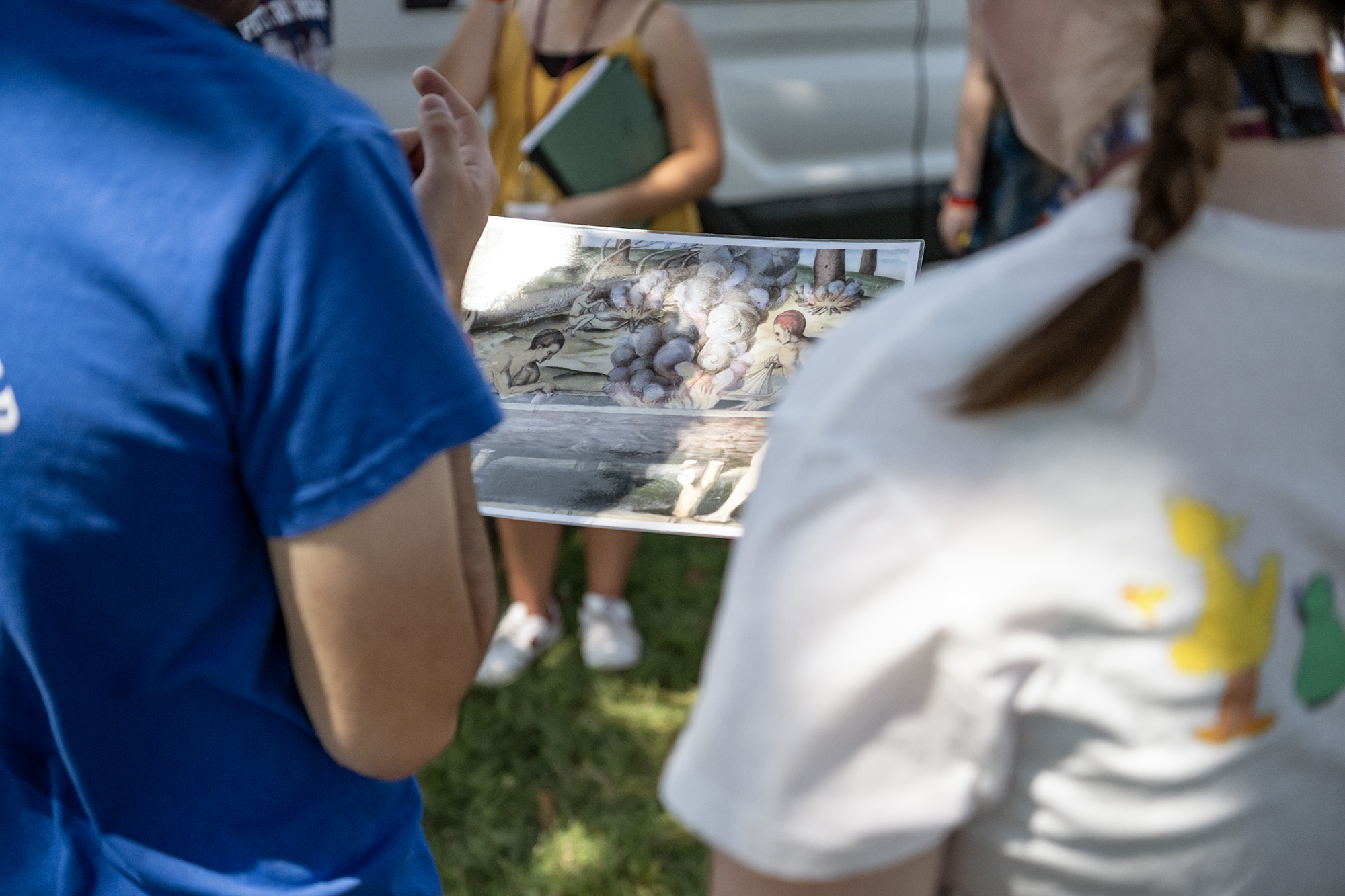 students looking at an artifact