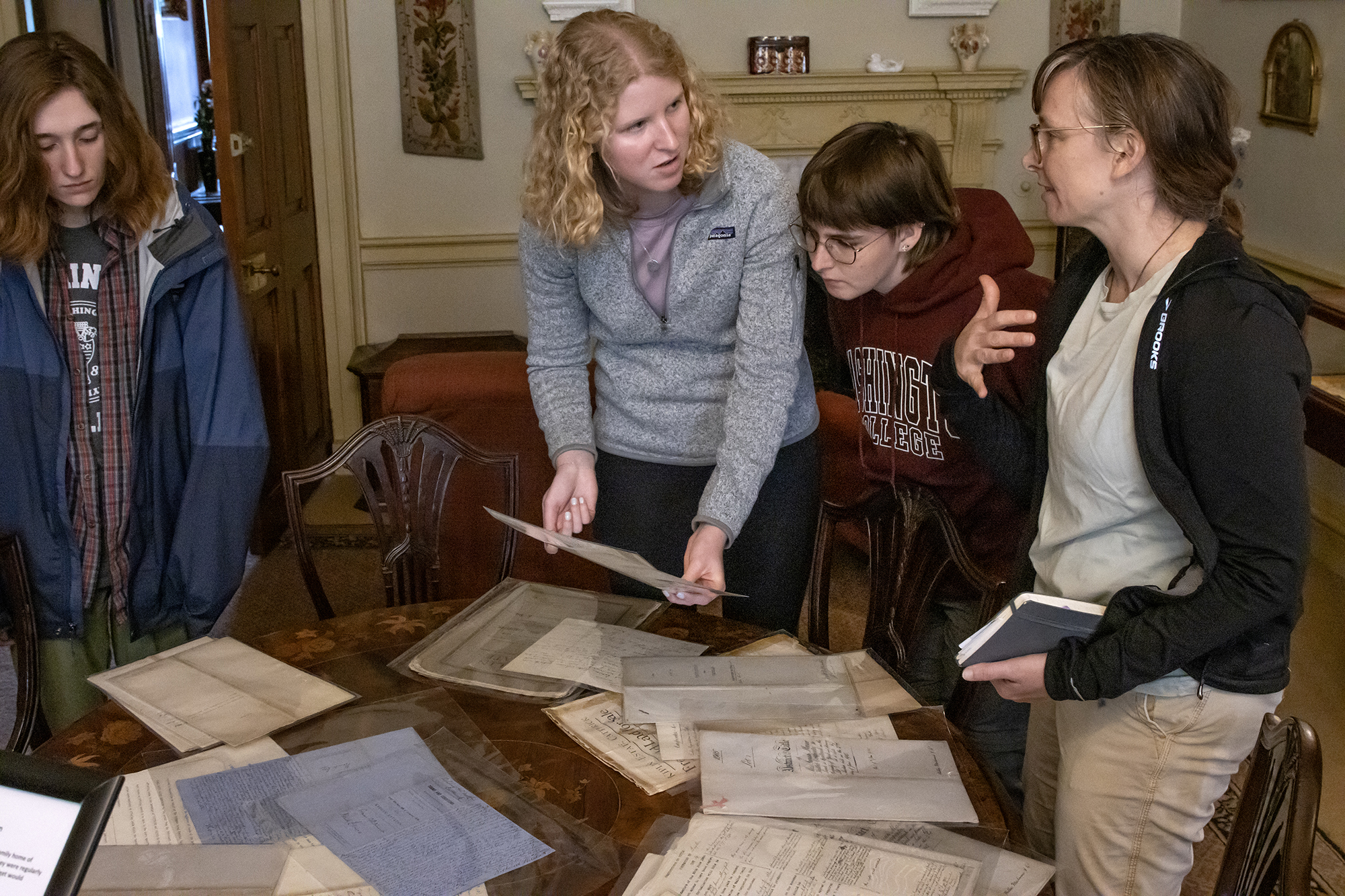 students looking at documents