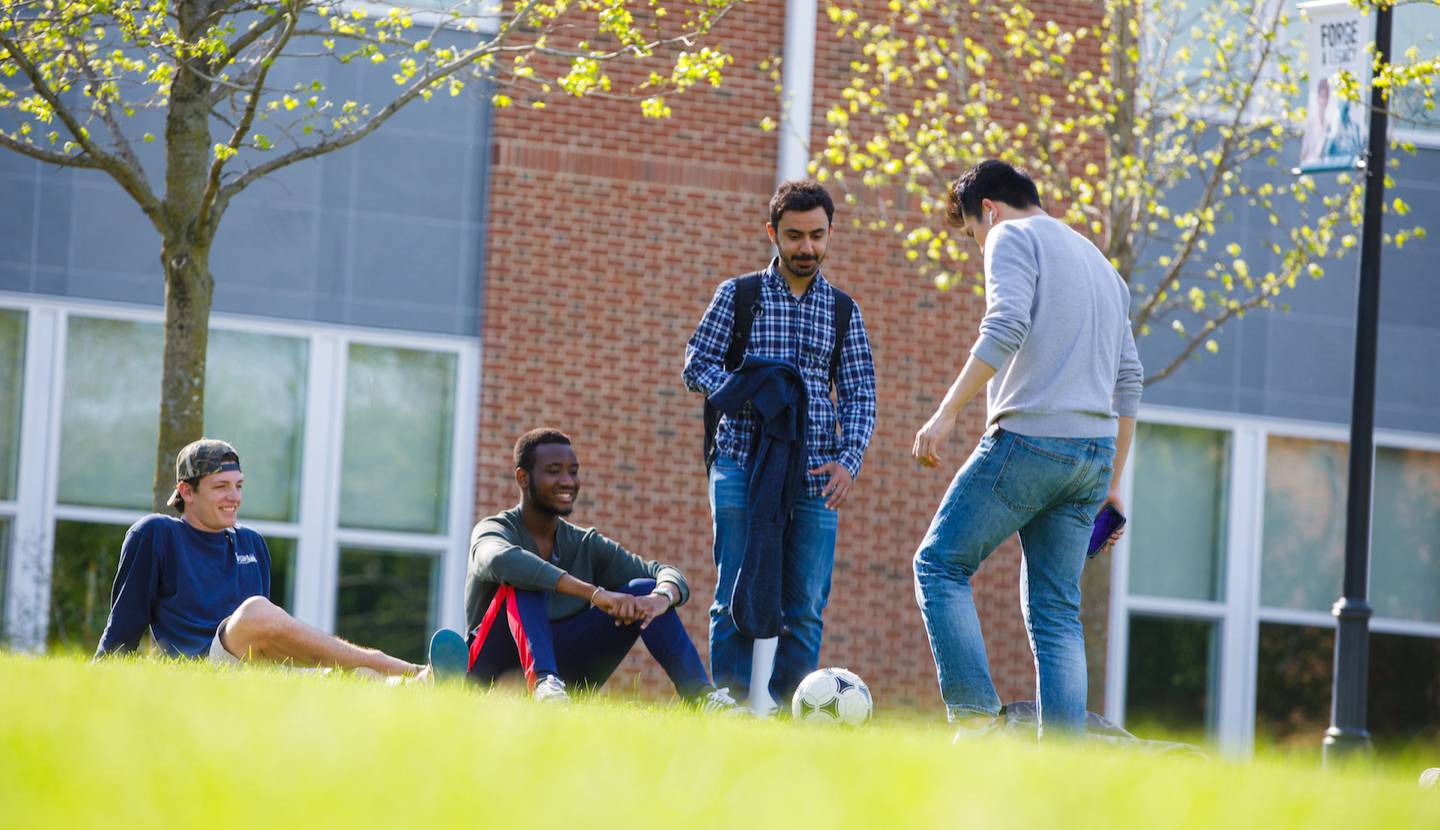 Students standing outside on campus