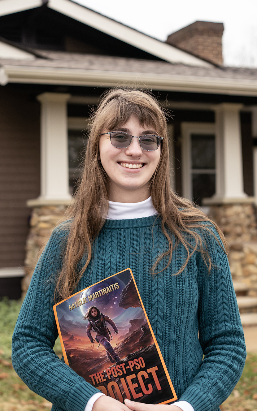 Natalie Martinaitis in front of the Publications House on Washington College's campus