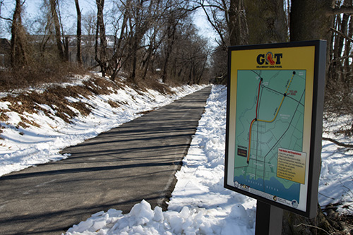 rail trail with river dorm in background
